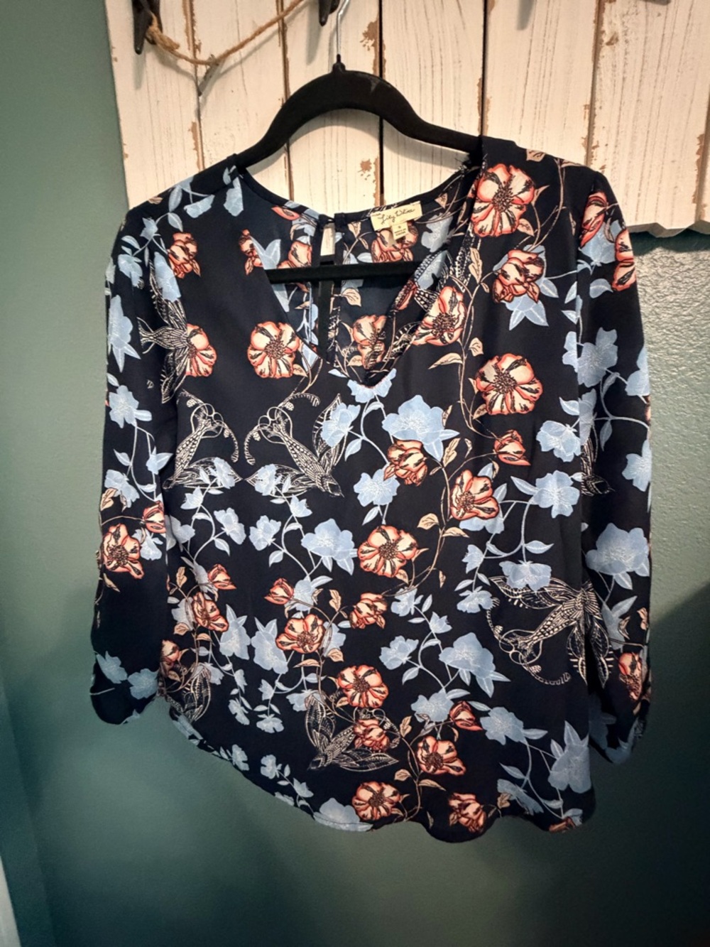 Lily White Navy Floral V-Neck Blouse with Coral & Light Blue Blooms